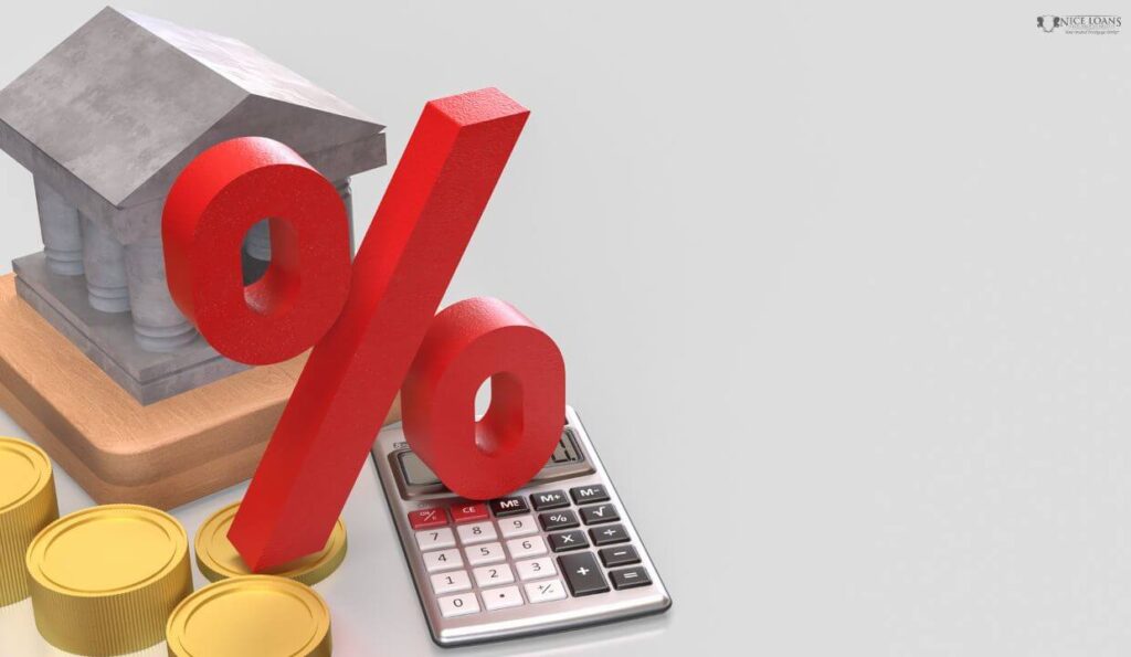 A house alongside a calculator with a large percentage symbol featured on top