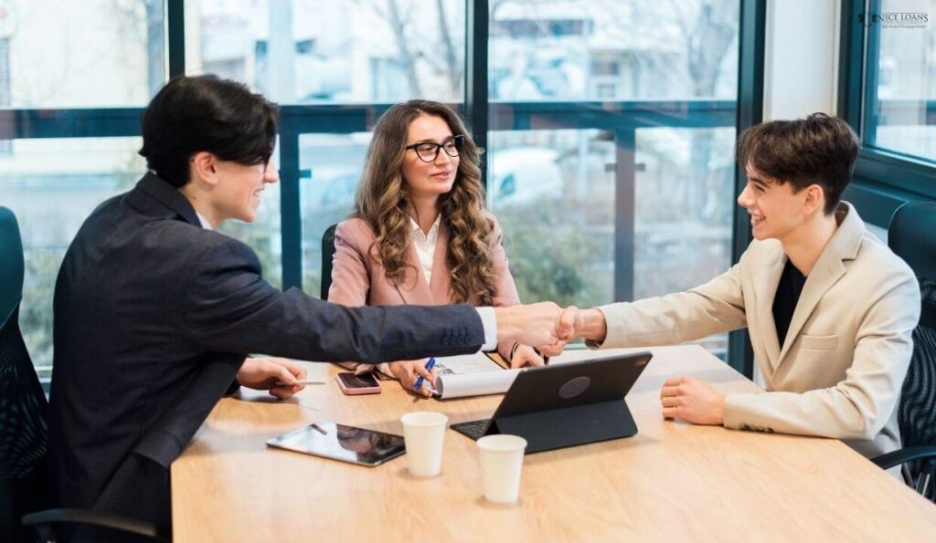 A deal being wrapped in the presence of three people. 