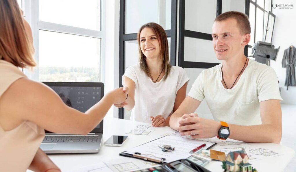 a couple sealing a deal on their home.