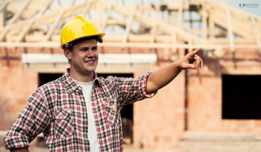 a construction worker pointing at something 