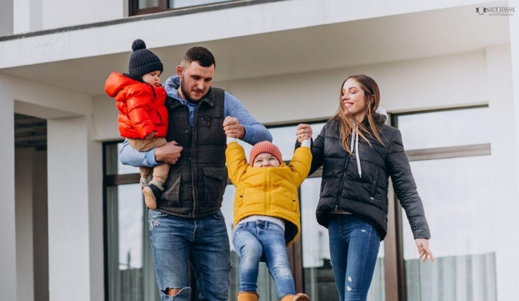 A family of four outside a home 
