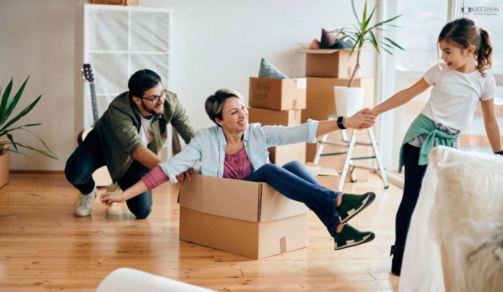 a family having fun in their living room as they're moving into a new place. 