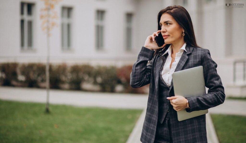 a buyer's agent in a classy suit on call outside her office.