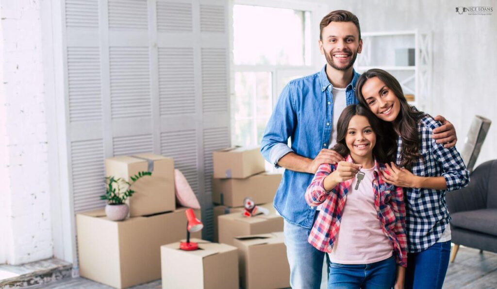a family of three with a teenage daughter holding their first home keys