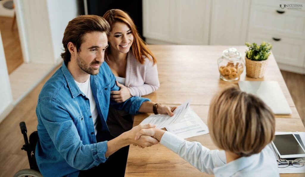 young couple happily coming to an agreement with mortgage broker on their home loan requirements